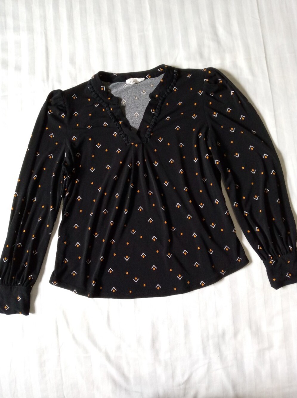 Women's Black Long-Sleeve V-Neck Blouse with Geometric Print. The Workshop Brand